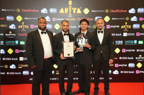 A group of four posing with the Spice Merchants trophy and certificate at ARTA 2026.
